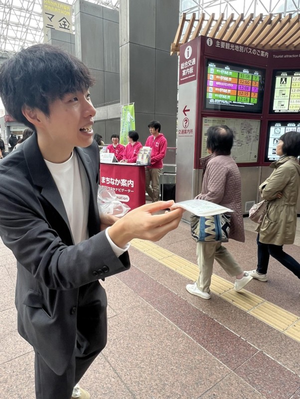 Members handing out pocket tissues as part of a stuttering awareness campaign.